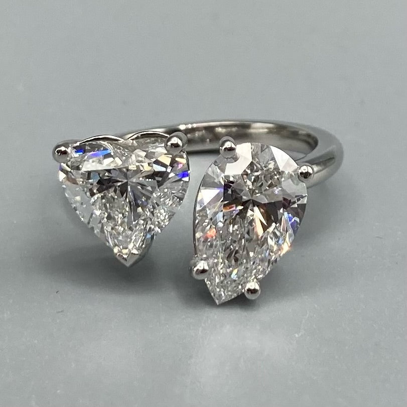 Heart Shaped and Pear Shaped Double Diamond Ring on Platinum band (PRICE ON REQUEST)