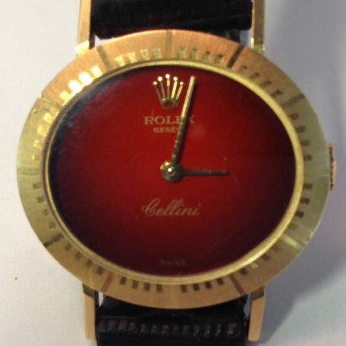 Rolex Cellini avec montre à cadran rouge en or jaune 18 carats